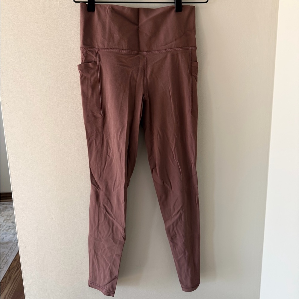 Athleta salutation stash pocket II tight